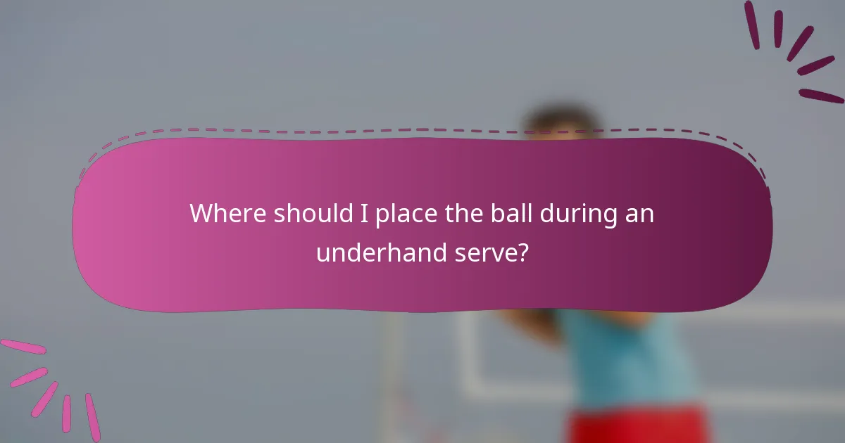 Where should I place the ball during an underhand serve?
